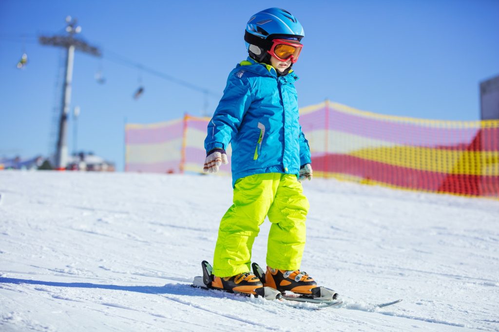 Little boy skiing downhill